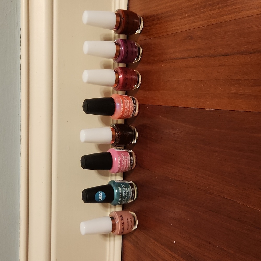 Assortment of different colored nail polish that are brand new, never used.